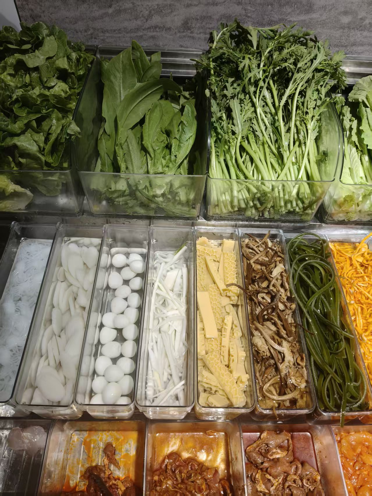 Fresh vegetables and toppings display